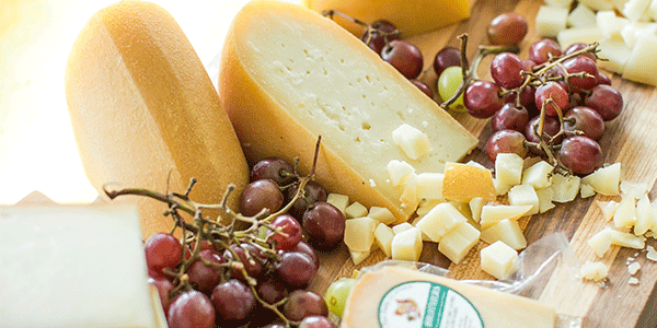 cheese board with fresh grapes
