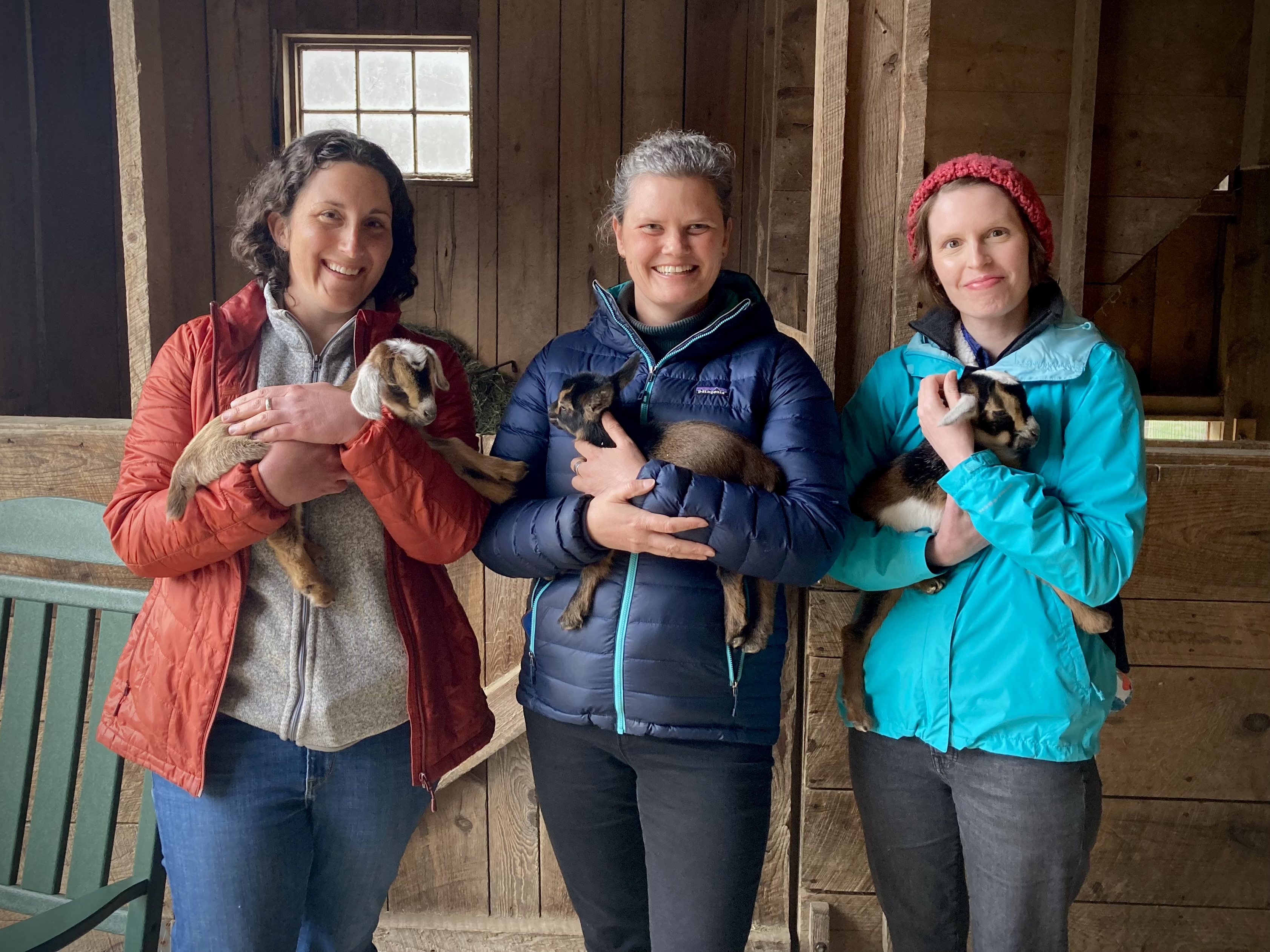 Laura, Kathryn, and Rebecca holding goat kids