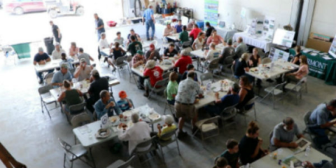 people sitting at an educational farm event