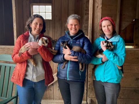 holding baby goats at Sunflower Farm