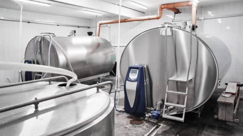 two stainless steel milk bulk tanks