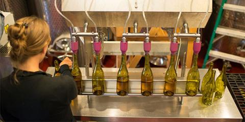 Woman filling bottles